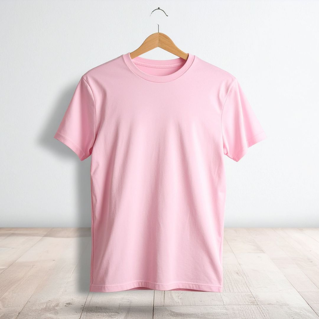 Pink T-shirt on a plain background.