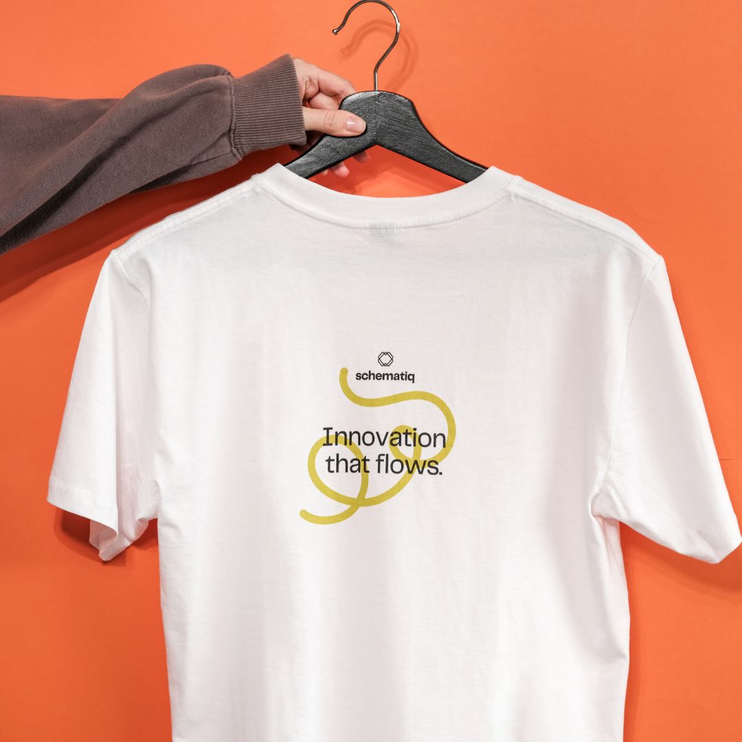 Orange and white graphic raglan T-shirt laid flat.