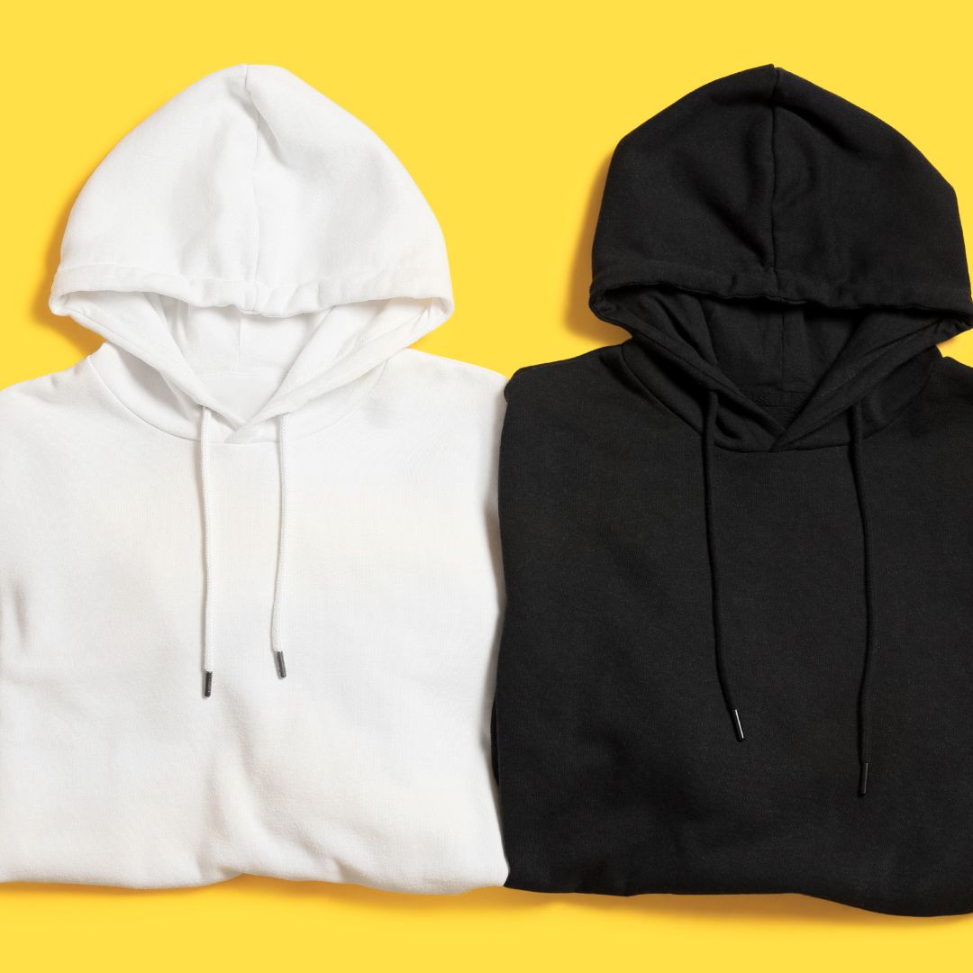 Three hoodies in white, yellow, and black displayed together.