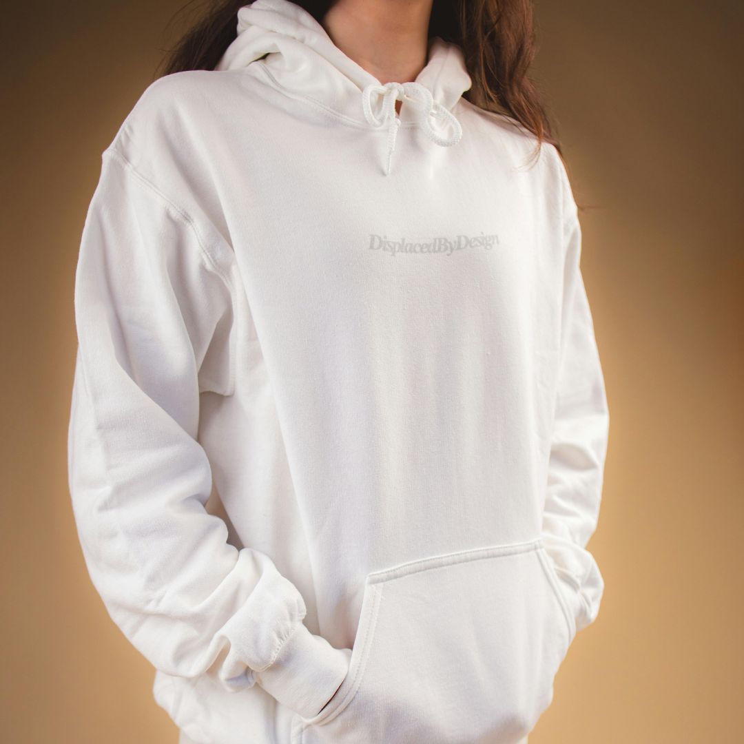 Model wearing a soft white pullover hoodie.