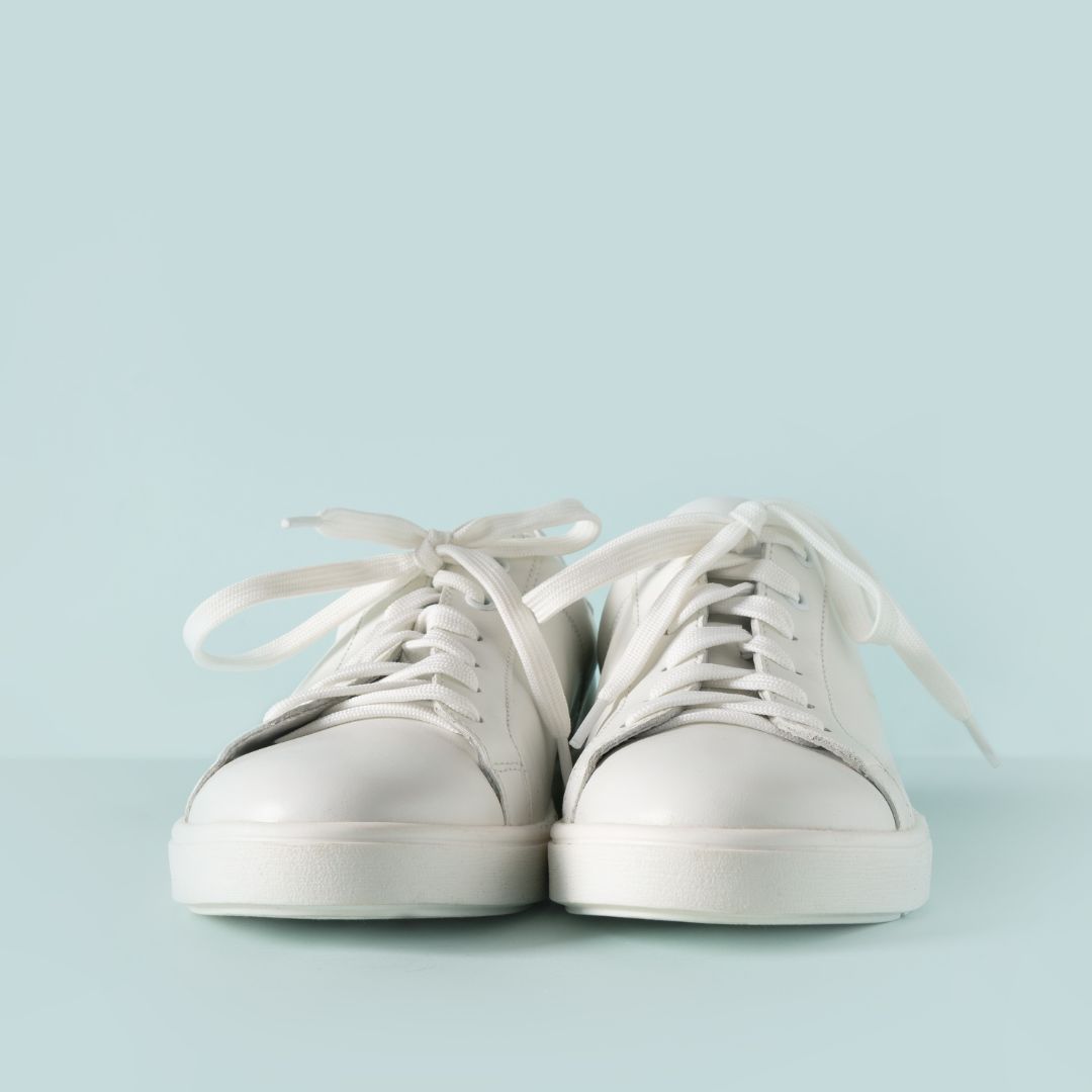 White sneaker pair on a white background.
