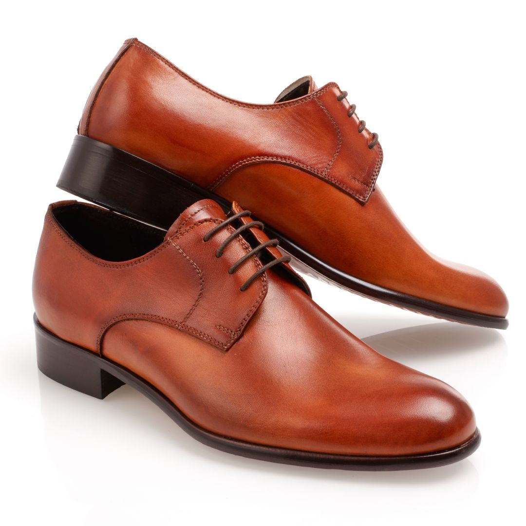 Brown oxford dress shoes displayed together.