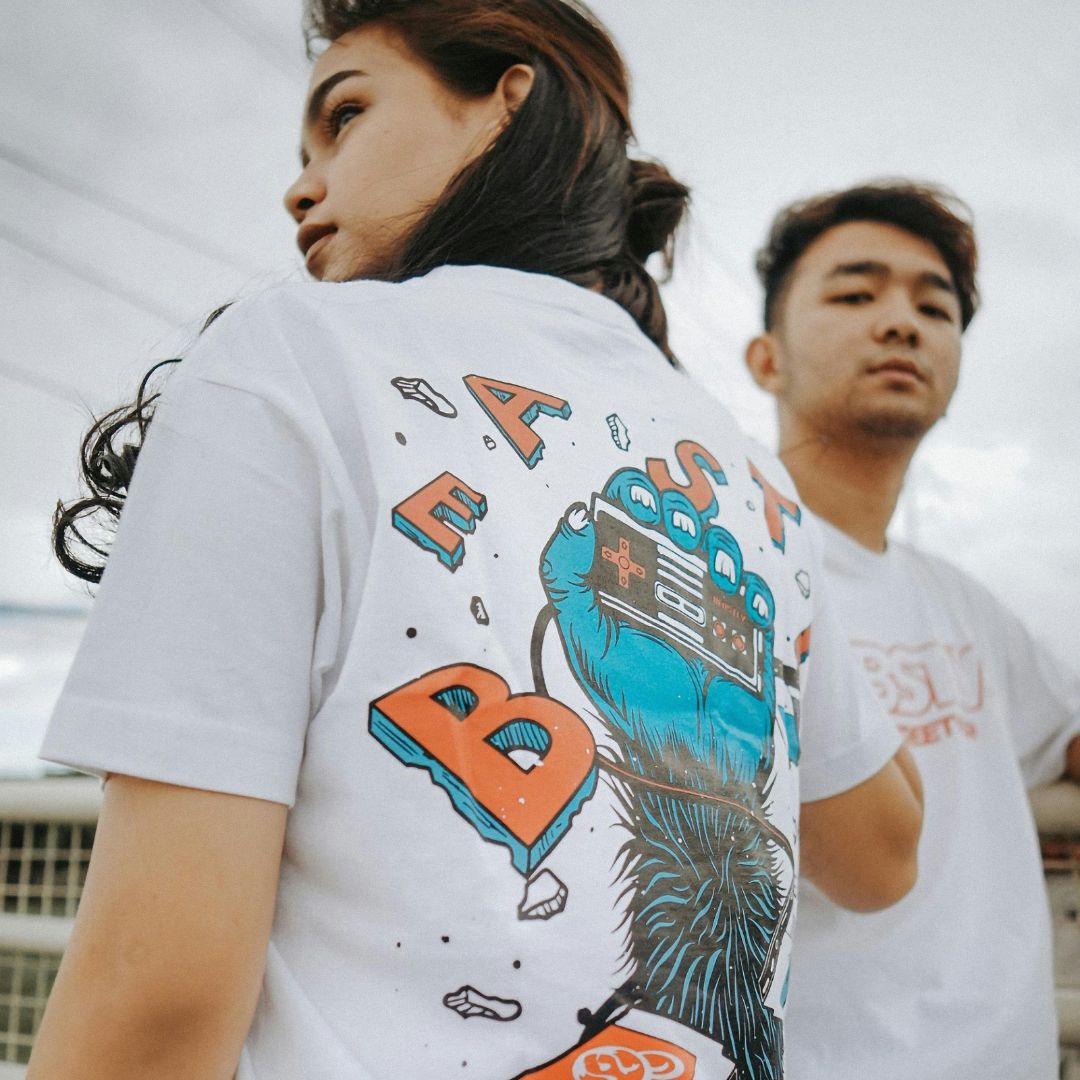 Graphic white T-shirt worn by models with a large back print.